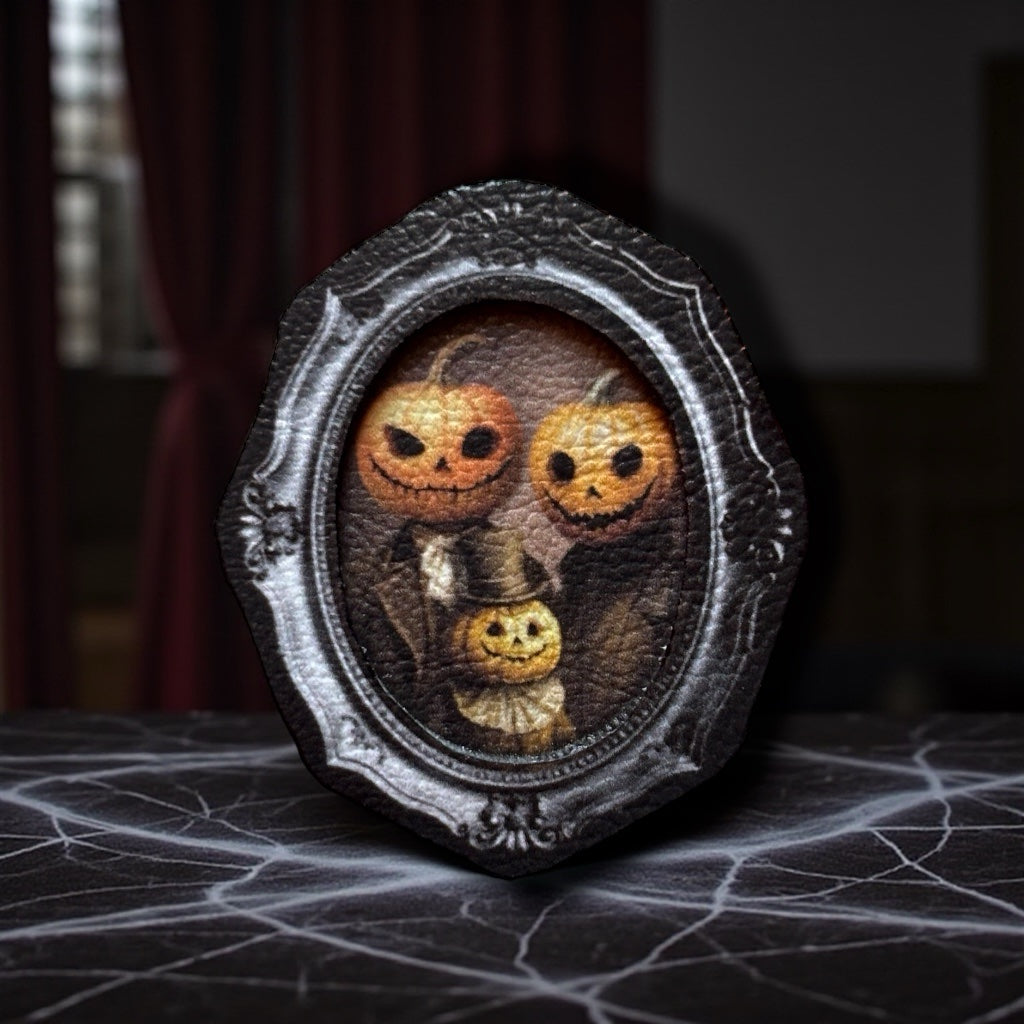 Broche. Portrait de famille citrouille